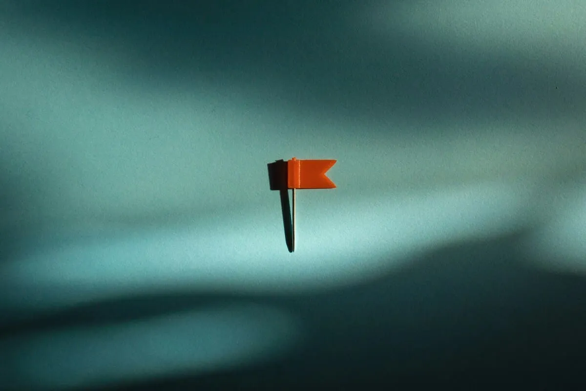Red map pin on light background, symbolizing location tracking